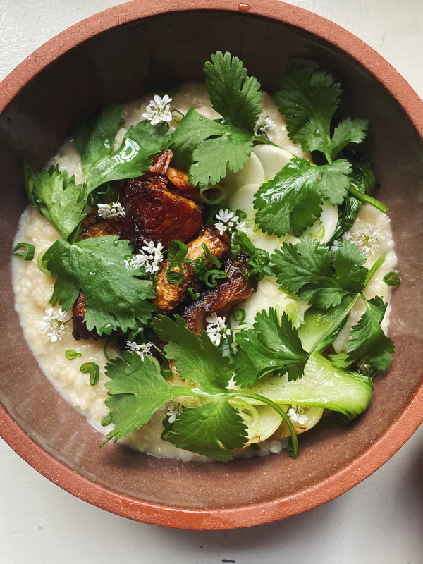 Ginger Congee with Chili Crispy Salmon and Seasonal Vegetables