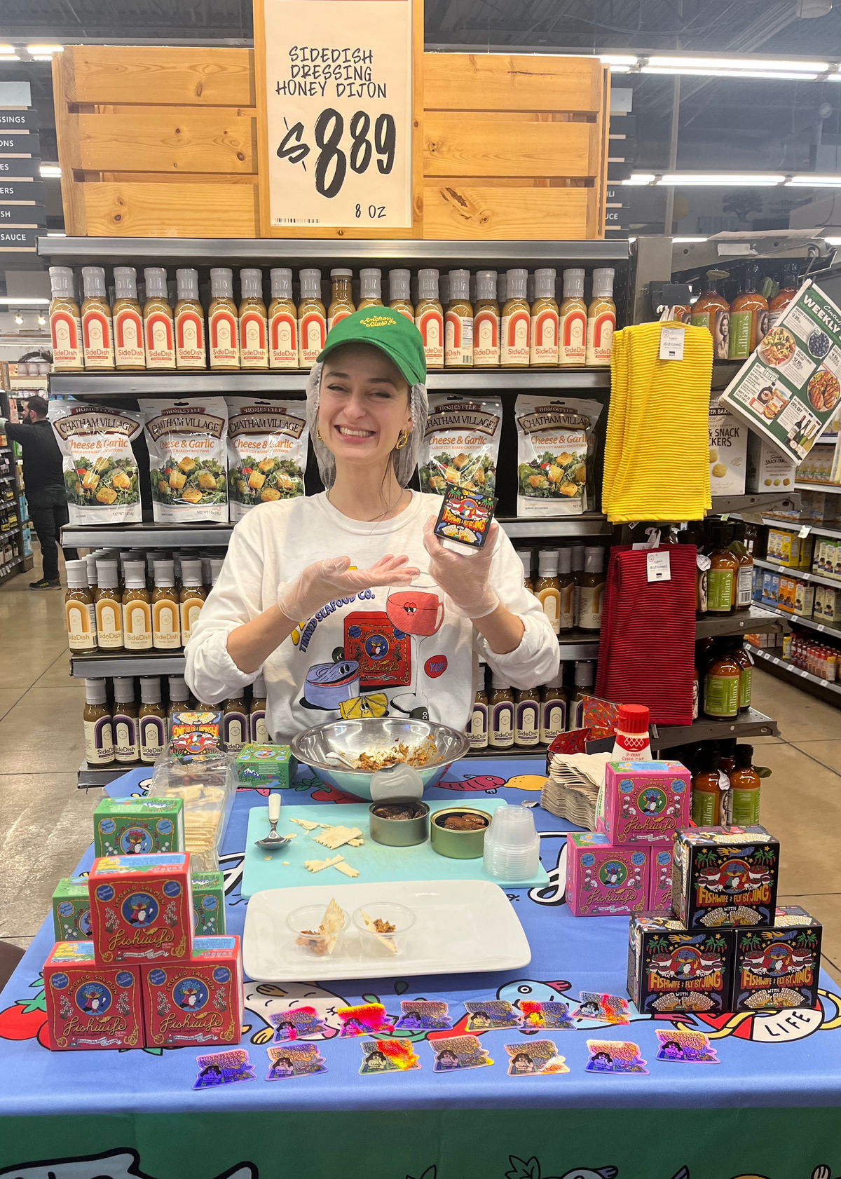 Becca Millstein, FIshwife's cofounder, presenting Fishwife in a grocery store. 